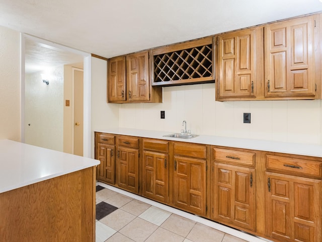 kitchen with light tile patterned flooring and sink