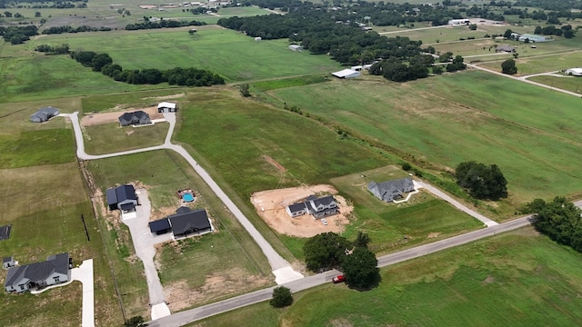 birds eye view of property featuring a rural view