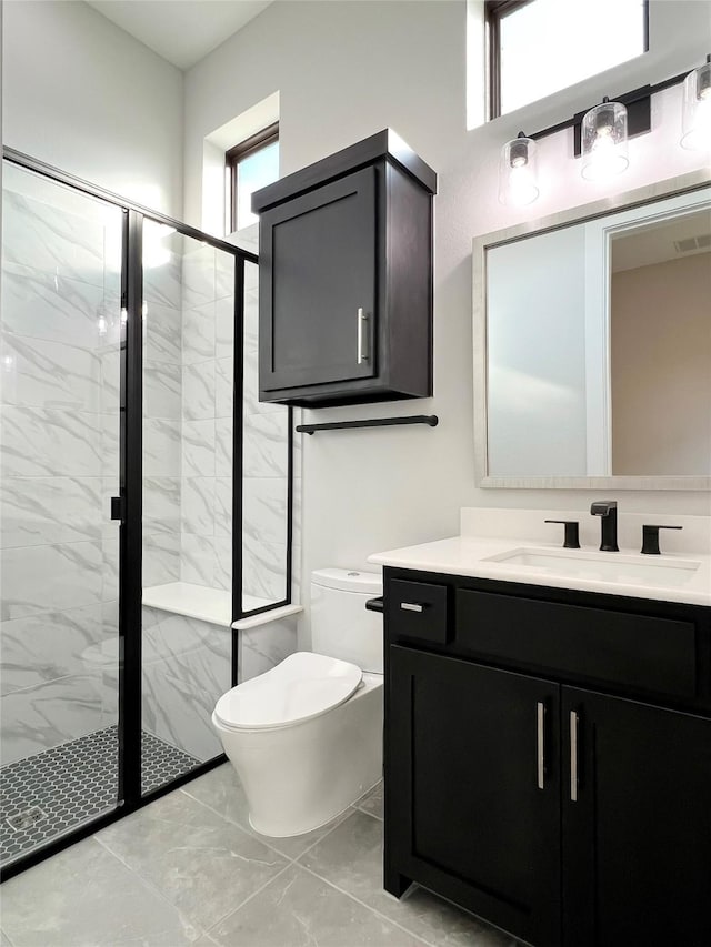 bathroom with vanity, an enclosed shower, and toilet