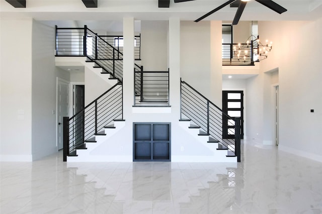 foyer with a chandelier and a towering ceiling