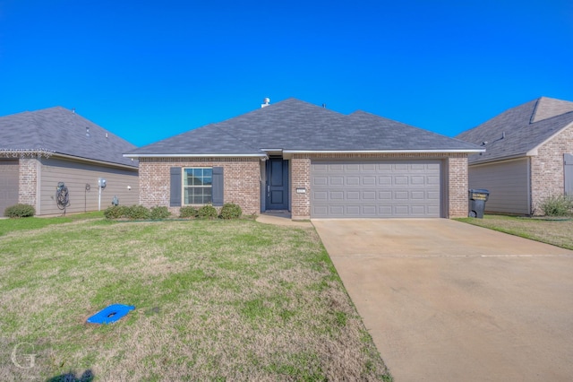 ranch-style home featuring a front yard and a garage