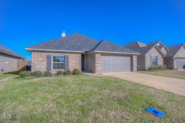 single story home with a garage and a front yard