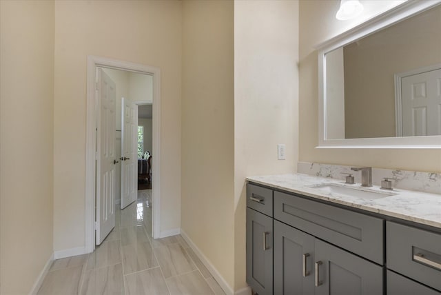 bathroom featuring vanity and baseboards