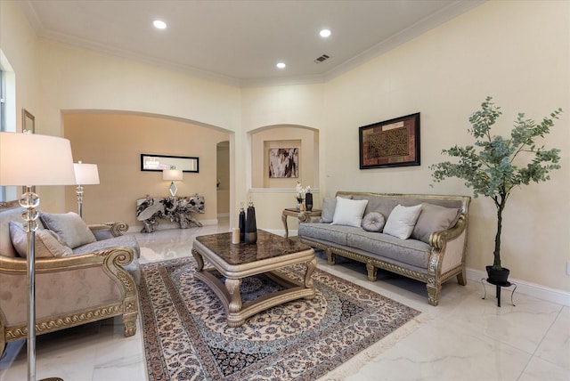 living room featuring ornamental molding, arched walkways, and marble finish floor