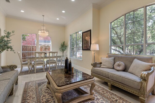 living room with a chandelier and a towering ceiling