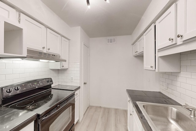 kitchen featuring white cabinetry, sink, black range with electric cooktop, and light hardwood / wood-style flooring