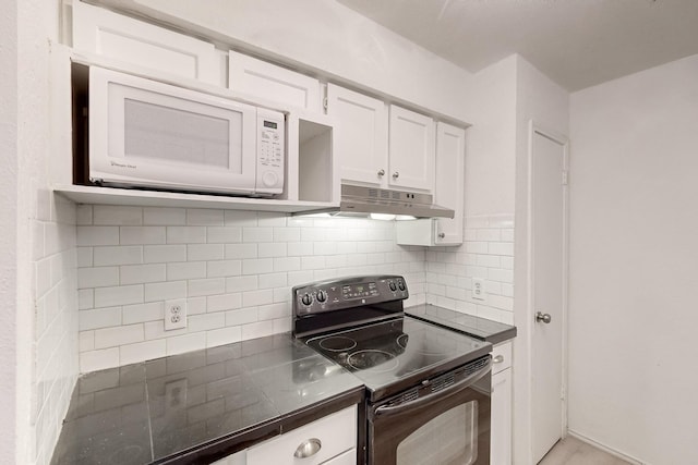 kitchen featuring decorative backsplash, white cabinetry, and black range with electric cooktop