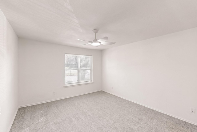 empty room with carpet and ceiling fan