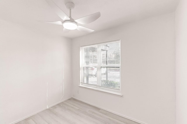 spare room with light hardwood / wood-style flooring and ceiling fan