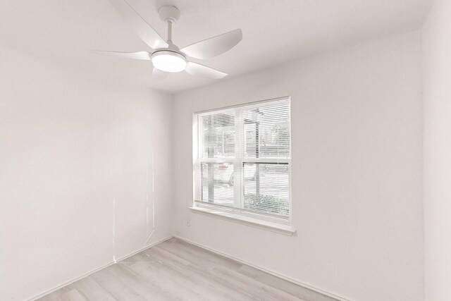 unfurnished room featuring ceiling fan and light wood-type flooring