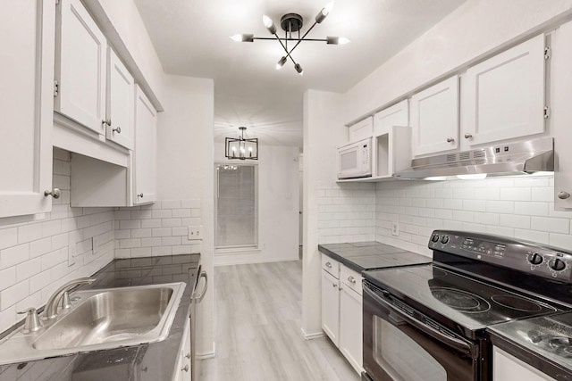 kitchen featuring decorative backsplash, sink, electric range, light hardwood / wood-style flooring, and white cabinetry