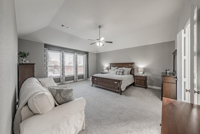 carpeted bedroom featuring lofted ceiling and ceiling fan