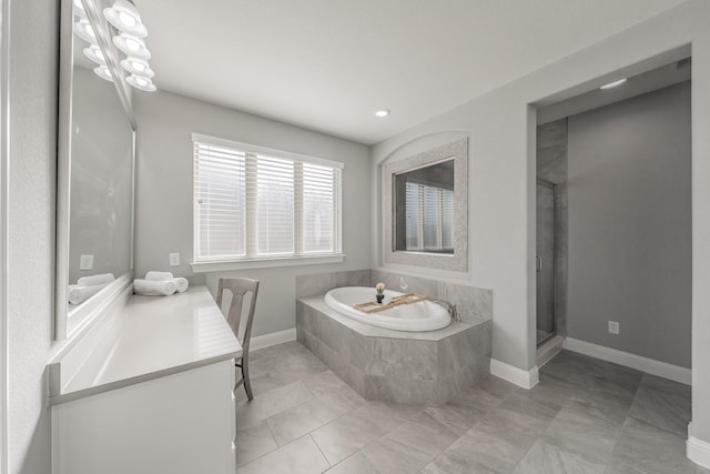 bathroom featuring vanity, tile patterned flooring, and independent shower and bath