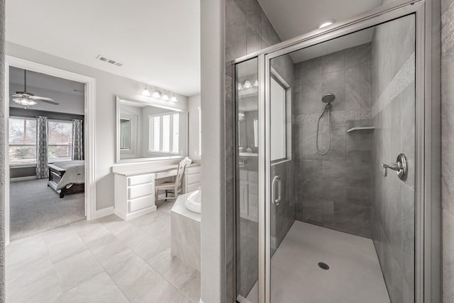 bathroom featuring ceiling fan and plus walk in shower