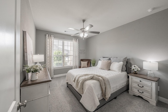 bedroom with ceiling fan and light colored carpet