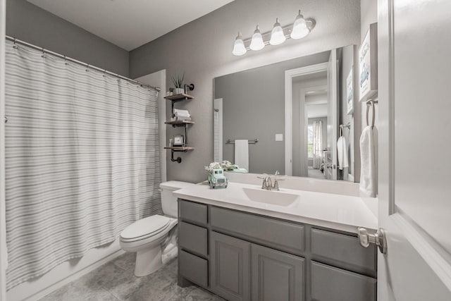 full bathroom with toilet, vanity, and shower / bathtub combination with curtain