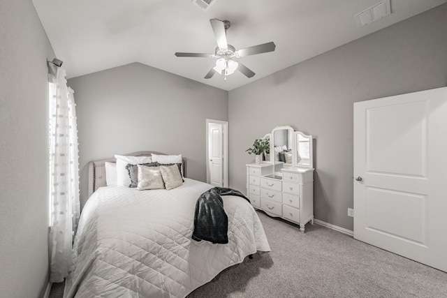 carpeted bedroom with ceiling fan and lofted ceiling