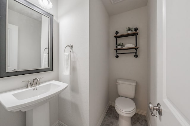 bathroom featuring toilet