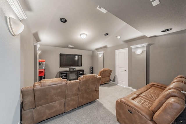 cinema room featuring light colored carpet