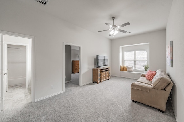 living room featuring ceiling fan and light carpet