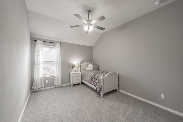 carpeted bedroom with lofted ceiling and ceiling fan