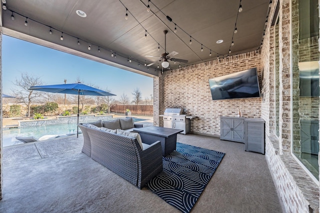 view of patio featuring ceiling fan, a fenced in pool, exterior kitchen, and grilling area