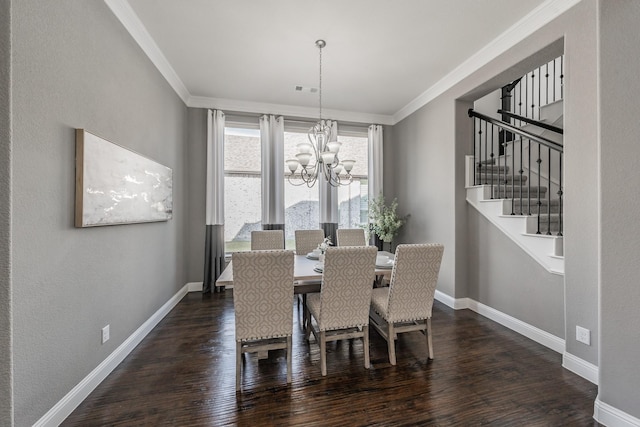 dining room with a notable chandelier, ornamental molding, and dark hardwood / wood-style floors