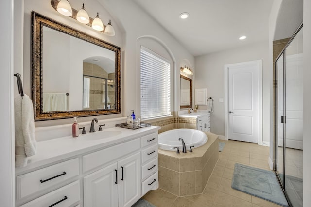 bathroom with vanity, tile patterned floors, and independent shower and bath