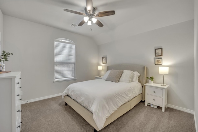 carpeted bedroom with vaulted ceiling and ceiling fan