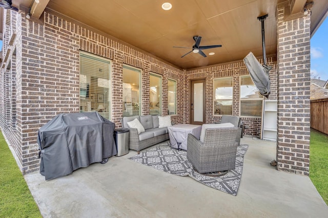 view of patio / terrace with area for grilling, ceiling fan, and an outdoor hangout area