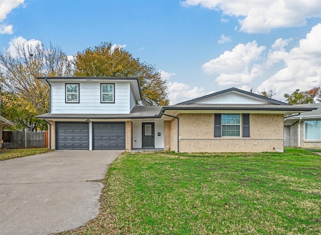 view of front of house featuring a garage and a front lawn