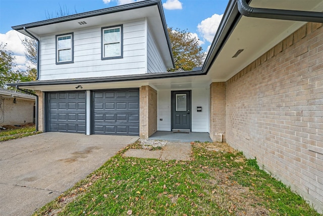 front facade with a garage