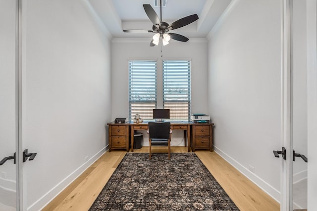 office with french doors, light hardwood / wood-style floors, and ornamental molding