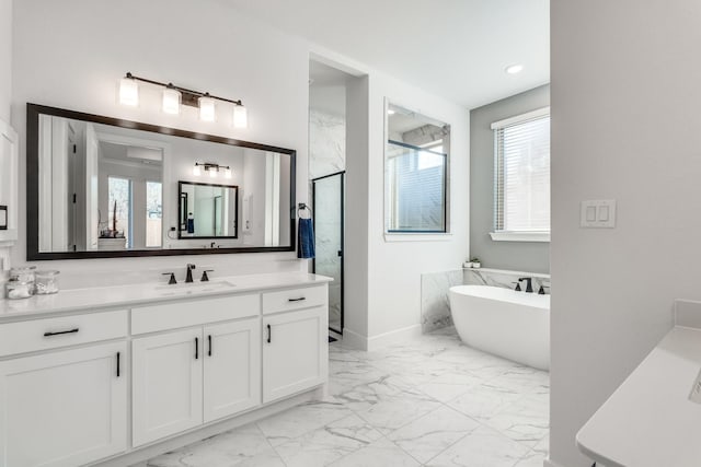 bathroom featuring shower with separate bathtub and vanity