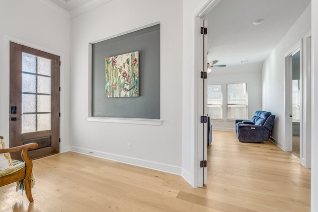 interior space featuring light hardwood / wood-style floors, ceiling fan, and a healthy amount of sunlight