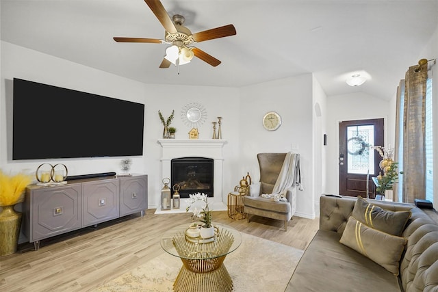 living room with ceiling fan and light hardwood / wood-style floors