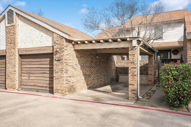 exterior space with a carport