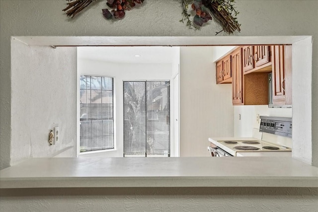 kitchen featuring white range with electric cooktop