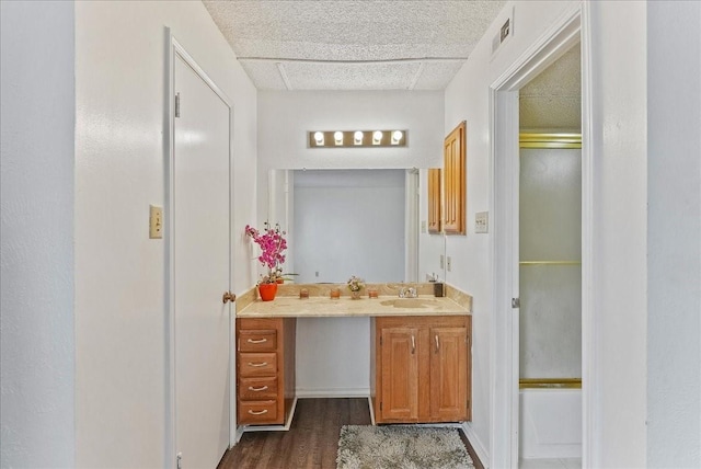 bathroom featuring vanity, shower / bath combination with glass door, and wood-type flooring