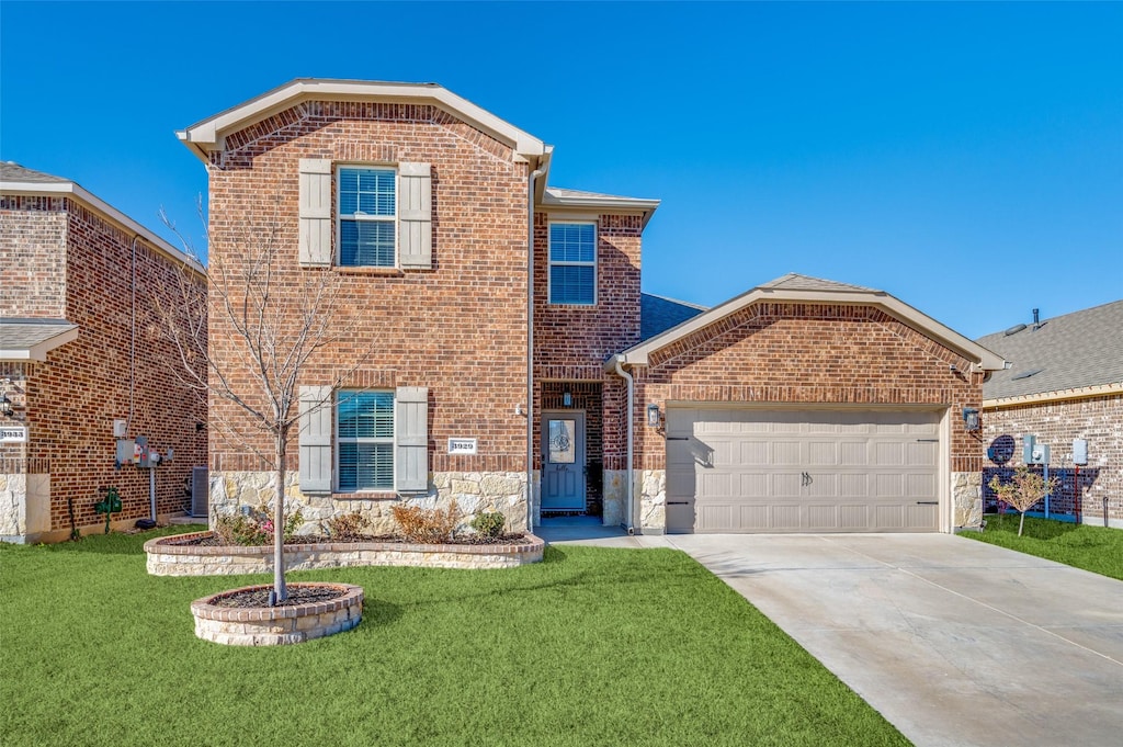 front of property with a garage and a front lawn