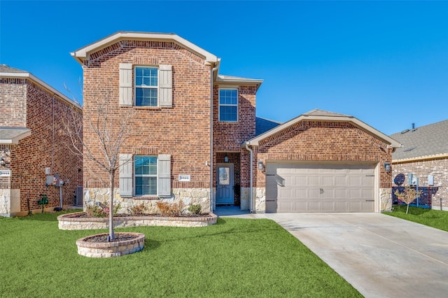 view of property featuring a front yard and a garage