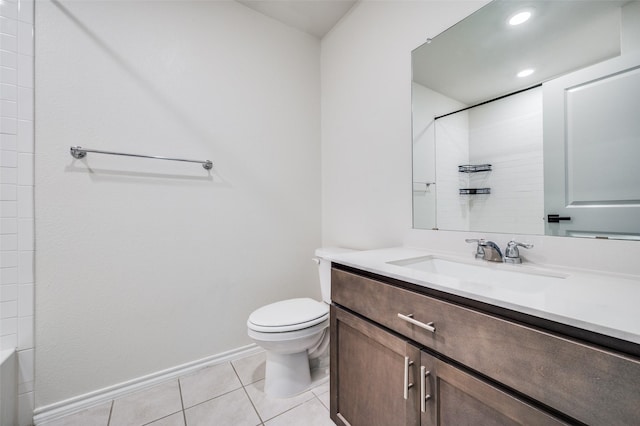 bathroom with vanity, toilet, and tile patterned flooring