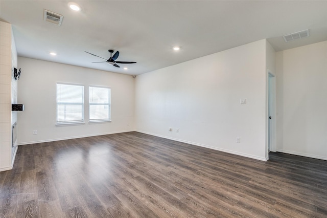 unfurnished room with dark hardwood / wood-style floors and ceiling fan