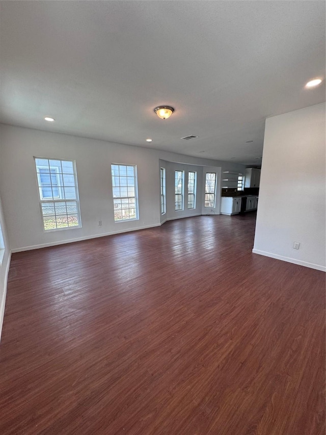 unfurnished living room with dark hardwood / wood-style floors