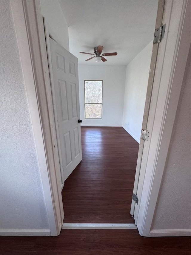 hall with dark hardwood / wood-style flooring