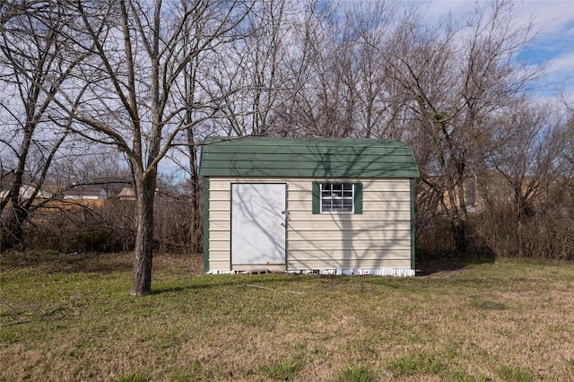 view of outdoor structure with a lawn