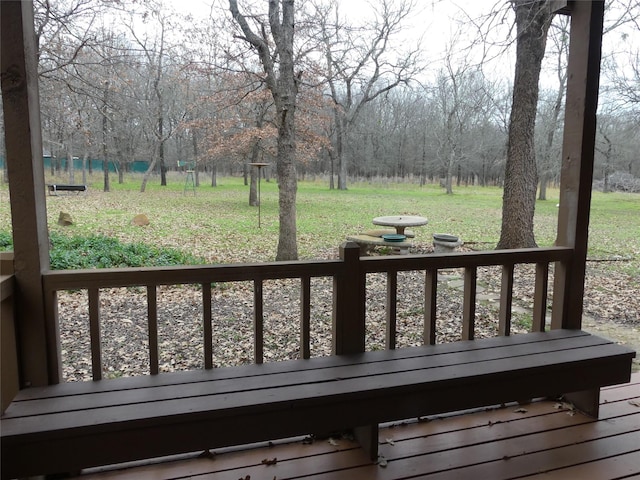 wooden terrace with a yard