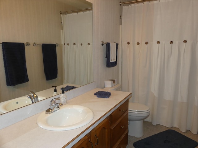 full bath featuring toilet, curtained shower, vanity, and wallpapered walls