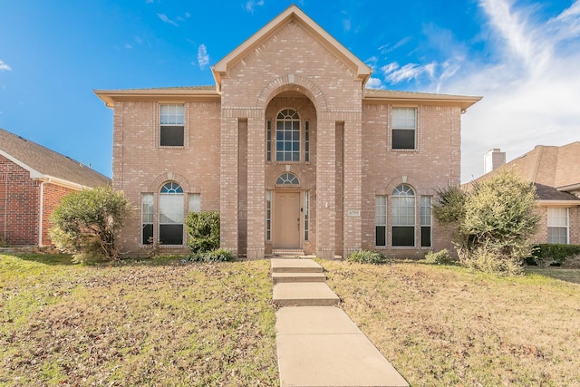 front facade with a front yard