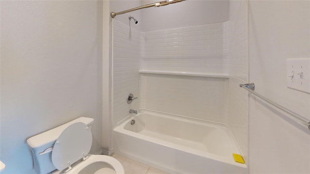 bathroom with tile patterned flooring, toilet, and tub / shower combination